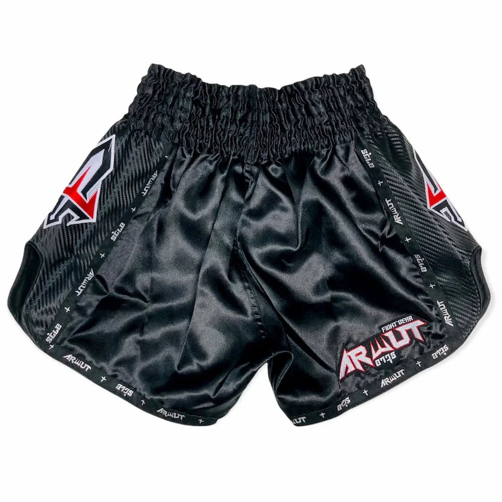Black athletic thai shorts with branding on a white background