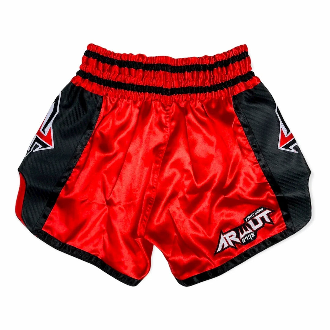 Red and black Muay Thai shorts with a brand logo on a white background