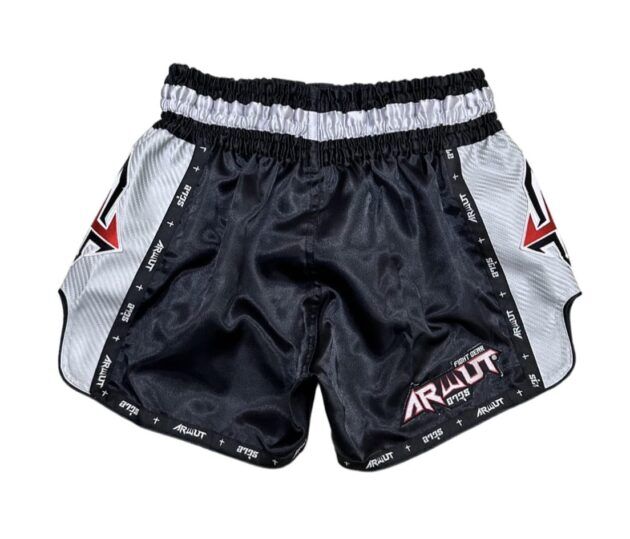 Black and gray Muay Thai shorts with brand logo on a white background