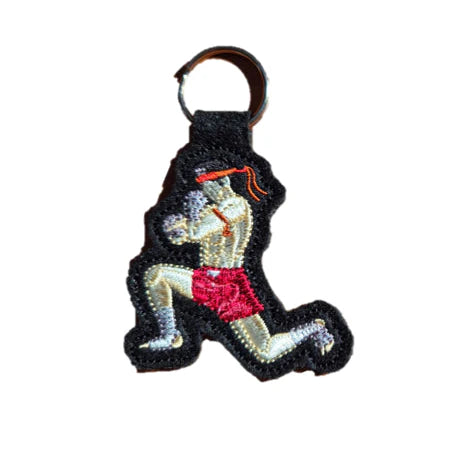 Keychain with a design of a Muay Thai boxer on a white background