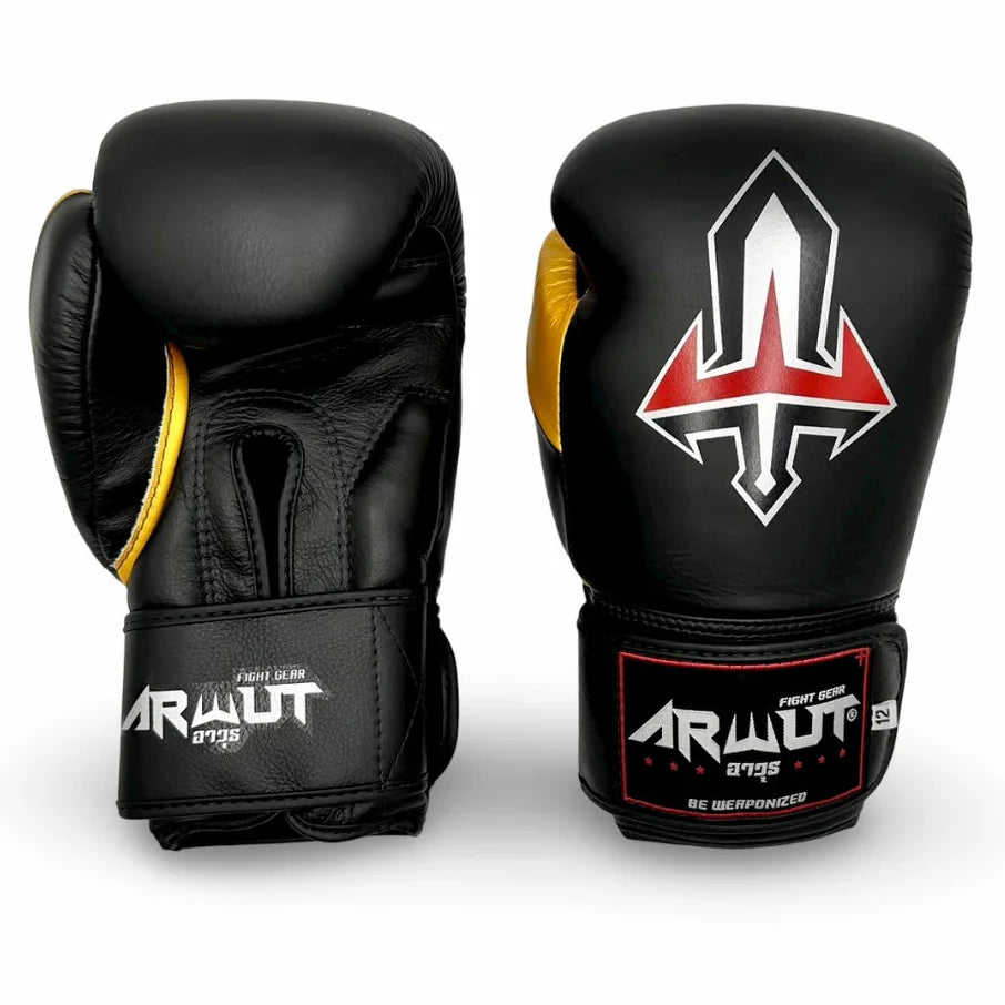Black and gold Arwut muay thai boxing gloves with a logo on a white background