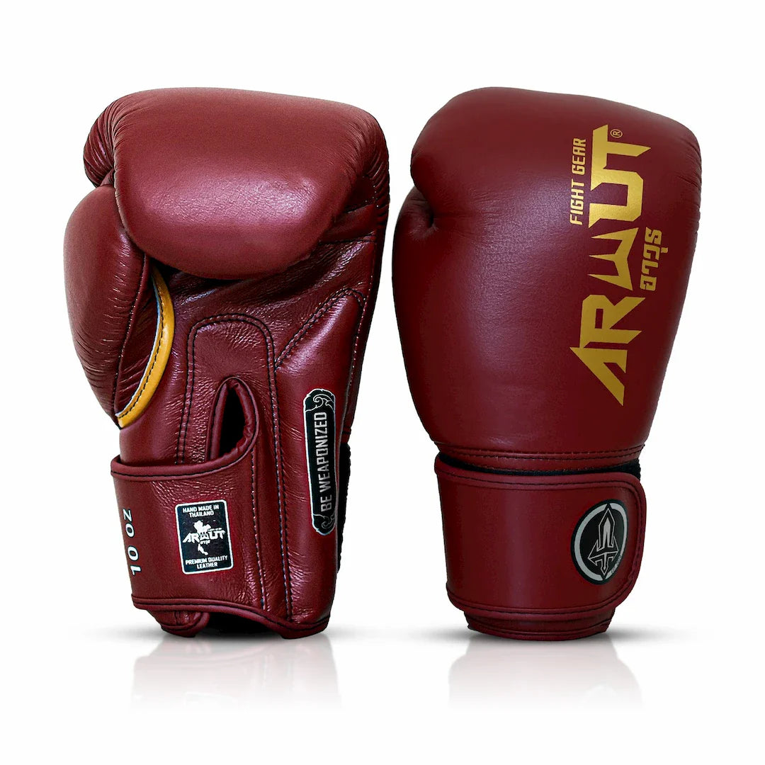 Pair of maroon boxing gloves with 'Arwut' branding on a white background