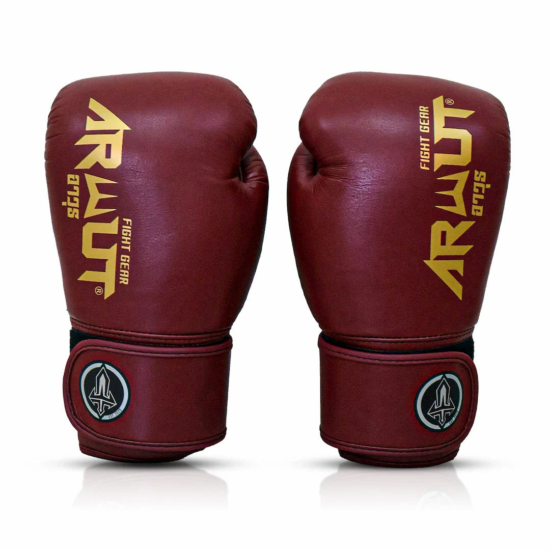 Pair of maroon Arwut boxing gloves with gold branding on a white background