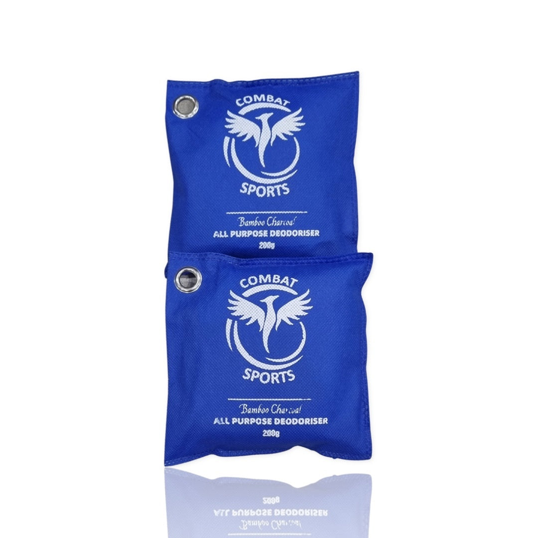 Two blue Combat Sports deodorizer packets on a white background
