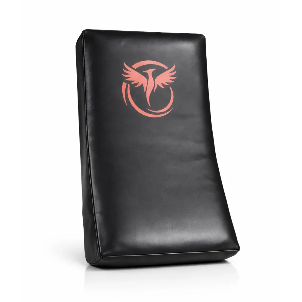 Black rectangular kick pad with a red logo on a white background