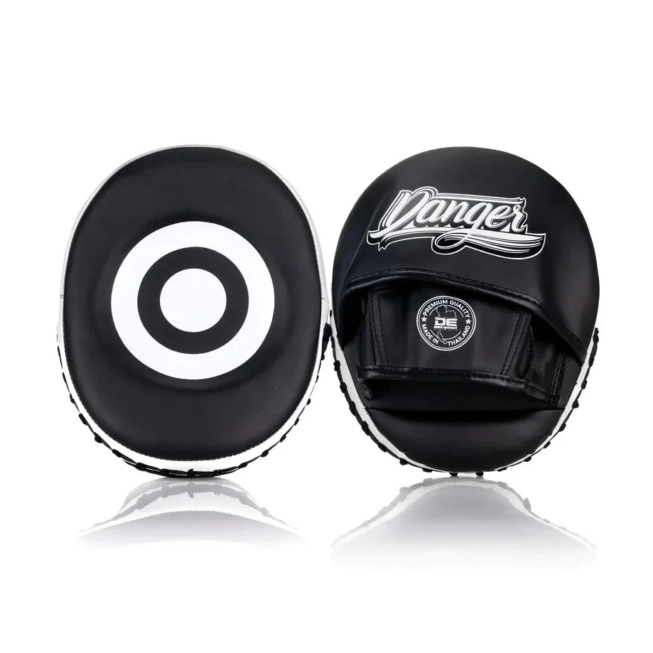 Black Danger focus mitts with a white target design on a white background