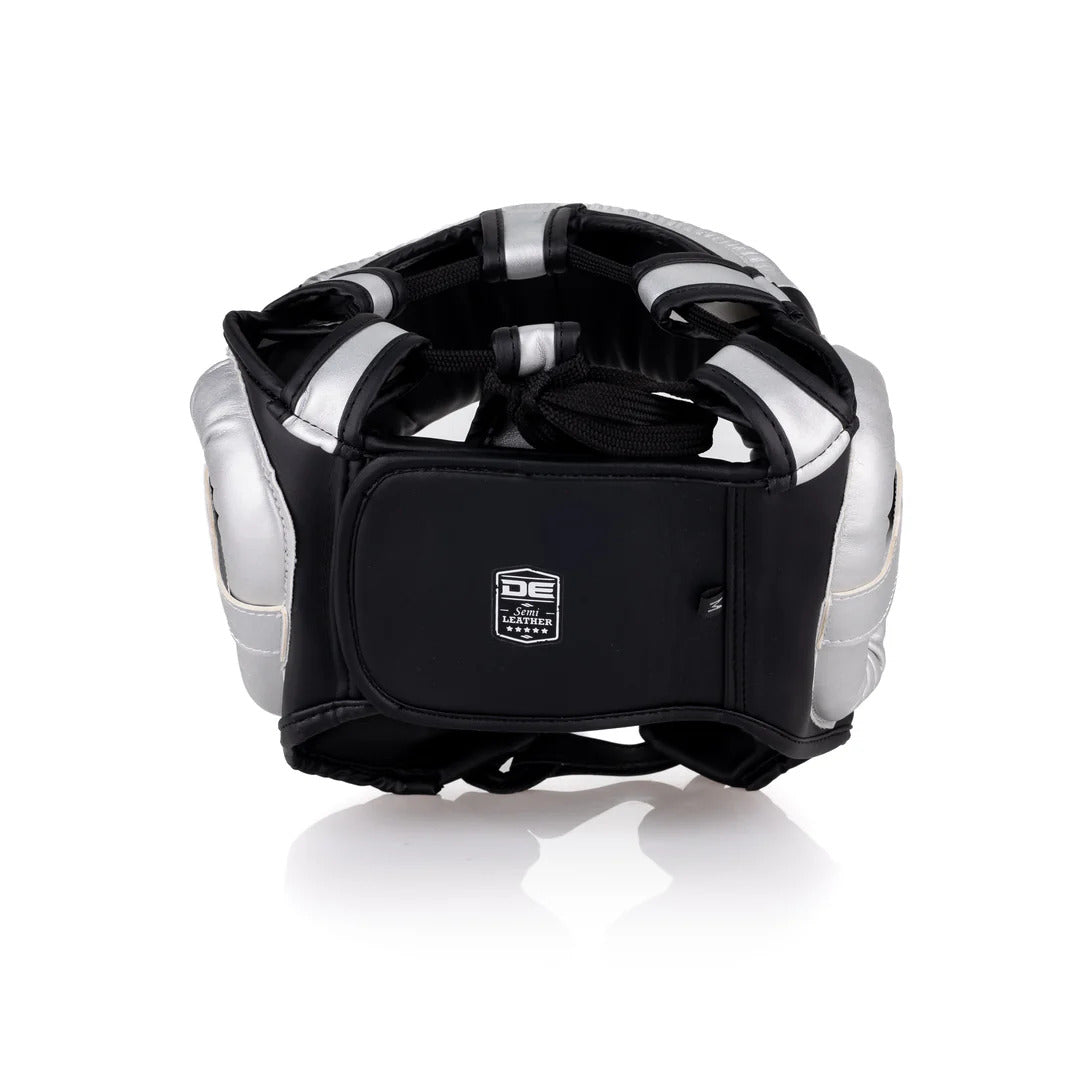 Back of a black and silver protective headgear with a brand logo on a white background