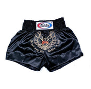 Black Muay Thai shorts with Fairtex logo and text on a white background