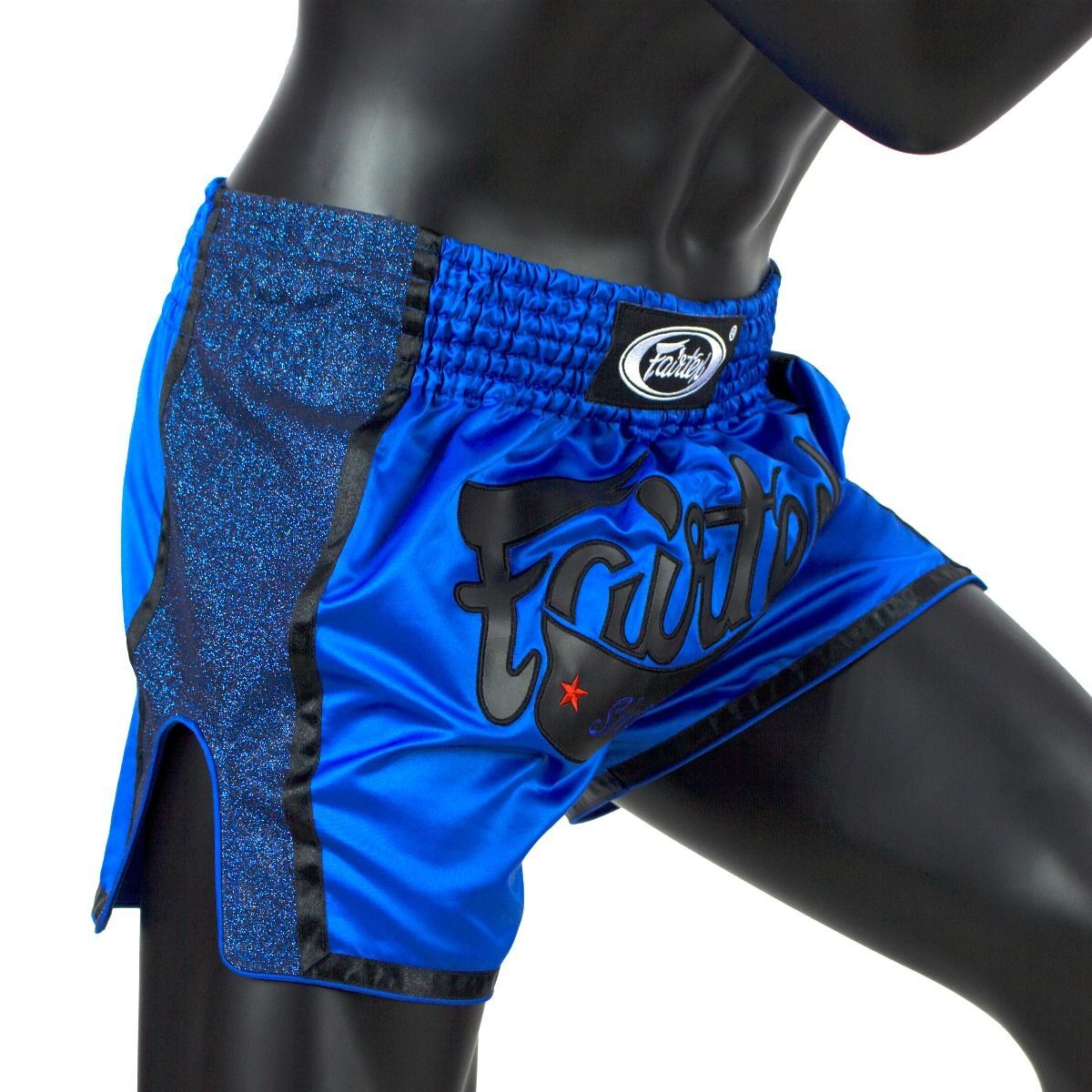 Blue and black Muay Thai shorts with branding on a mannequin.