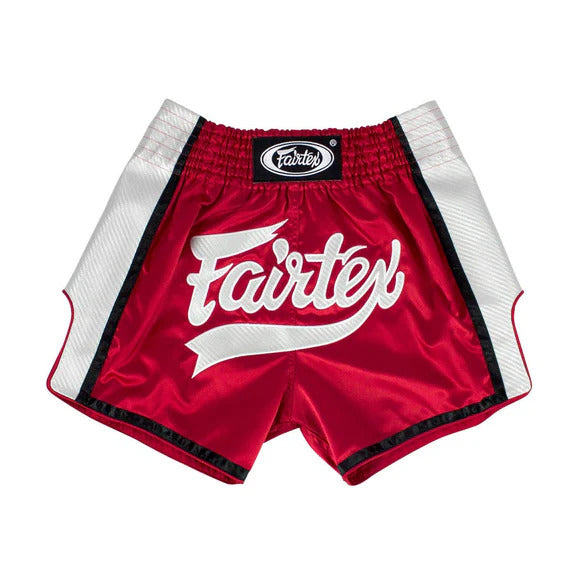 Red Muay Thai shorts with 'Fairtex' branding on a white background