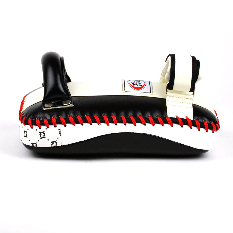 Black and white martial Muay Thai pad with red stitching on a white background