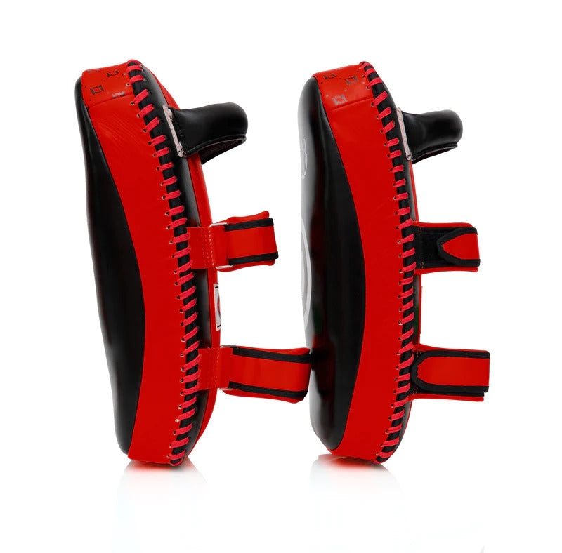 Red and black Muay Thai pads on a white background