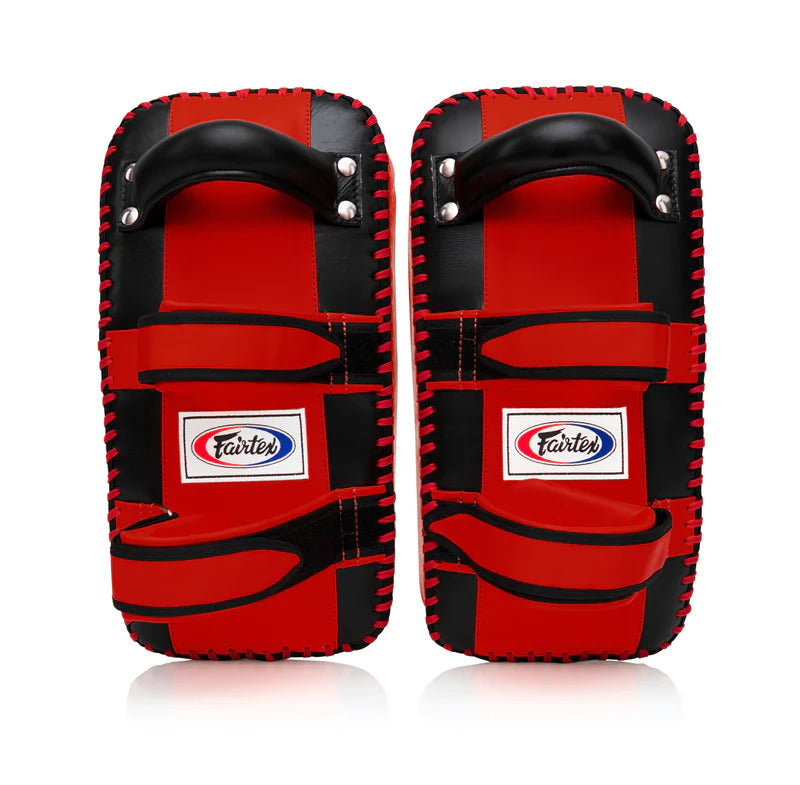 Pair of red and black Muay Thai pads with Fairtex logo on a white background
