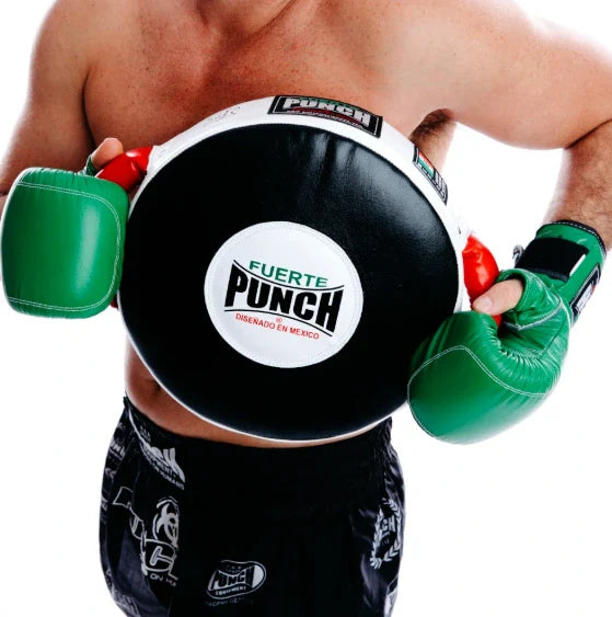 Person wearing green boxing gloves and black punching bag with 'Fuerte Punch' branding.
