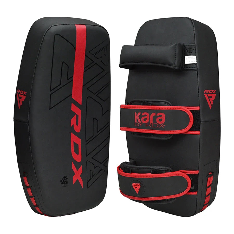 Black and red RDX Kara thai pads on a white background