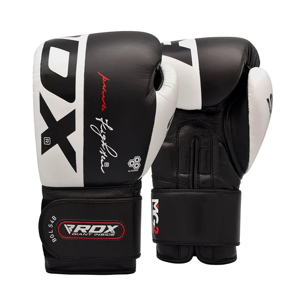 Pair of black and white boxing gloves with visible branding on a white background