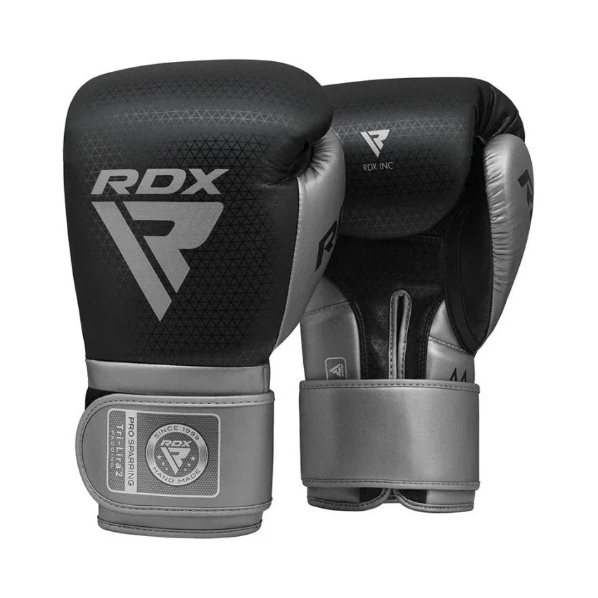 Pair of black and gray RDX boxing gloves on a white background