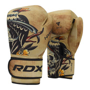 Pair of RDX boxing gloves with tribal design on a white background