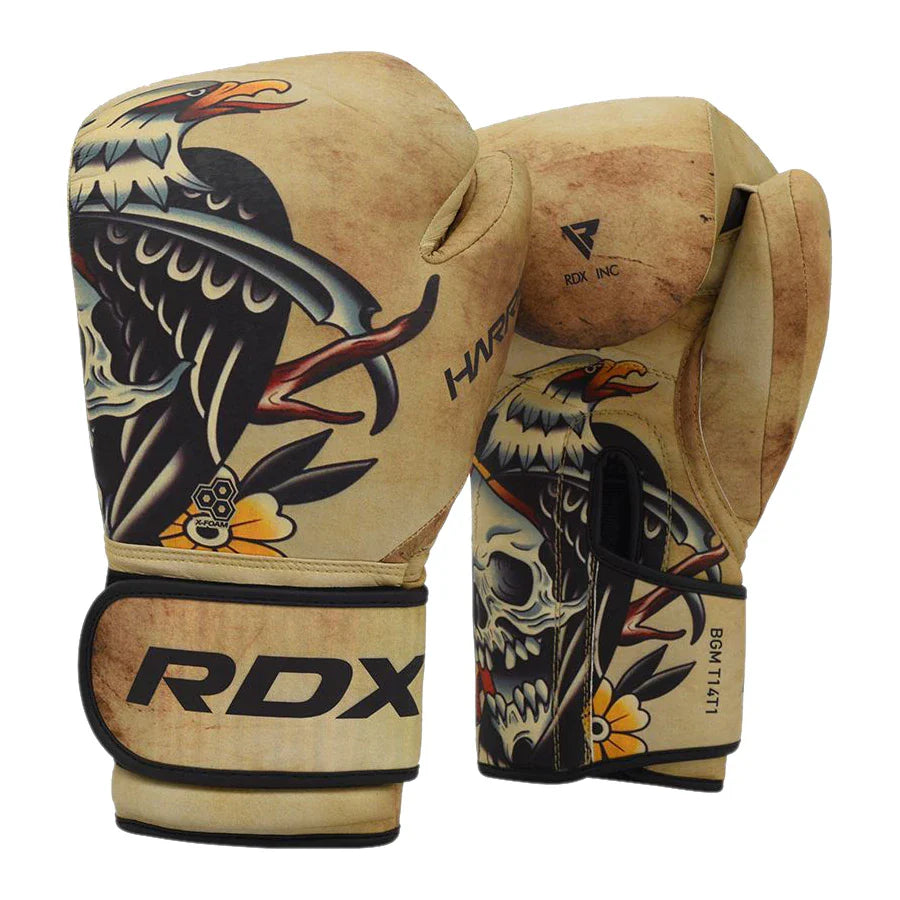 Pair of RDX boxing gloves with tribal design on a white background