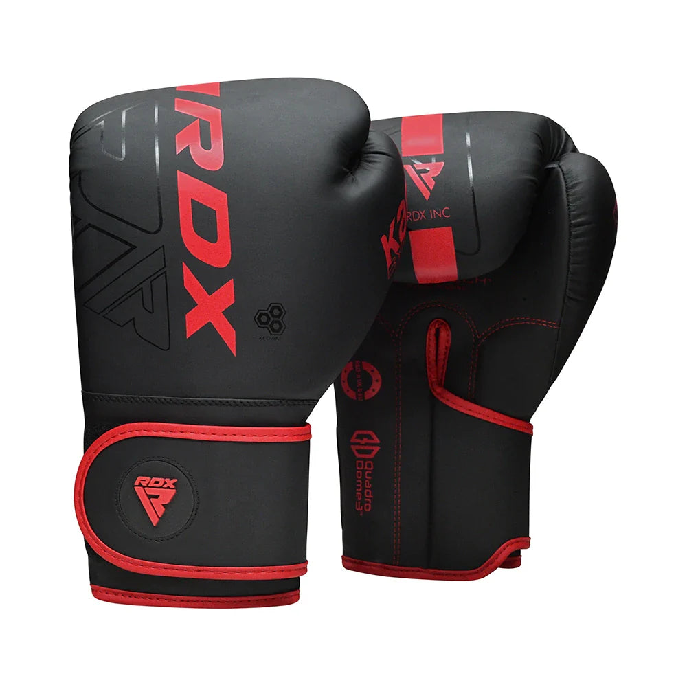 Black boxing gloves with red accents and RDX branding on a white background