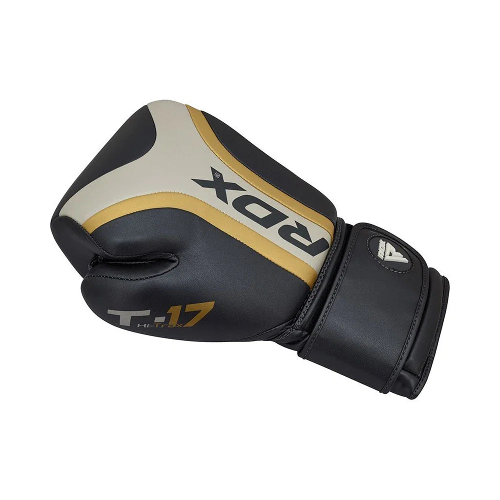 Black boxing glove with gold and white accents on a white background
