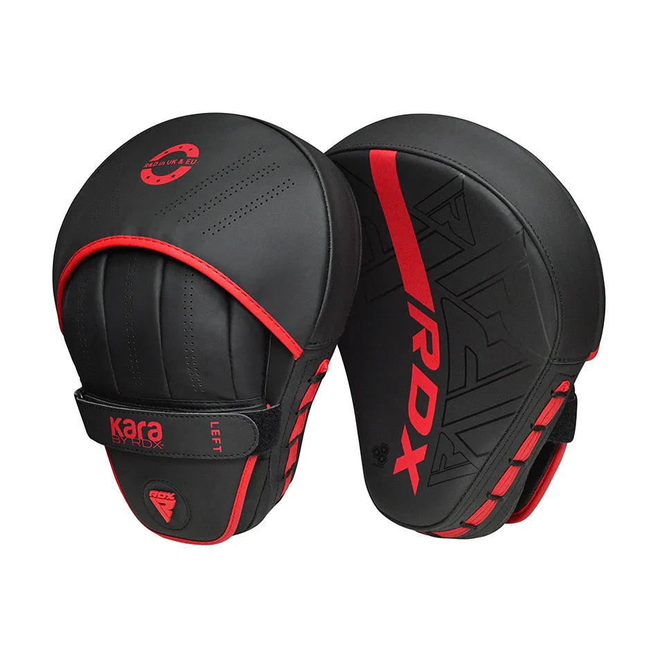 Black and red RDX boxing pads on a white background