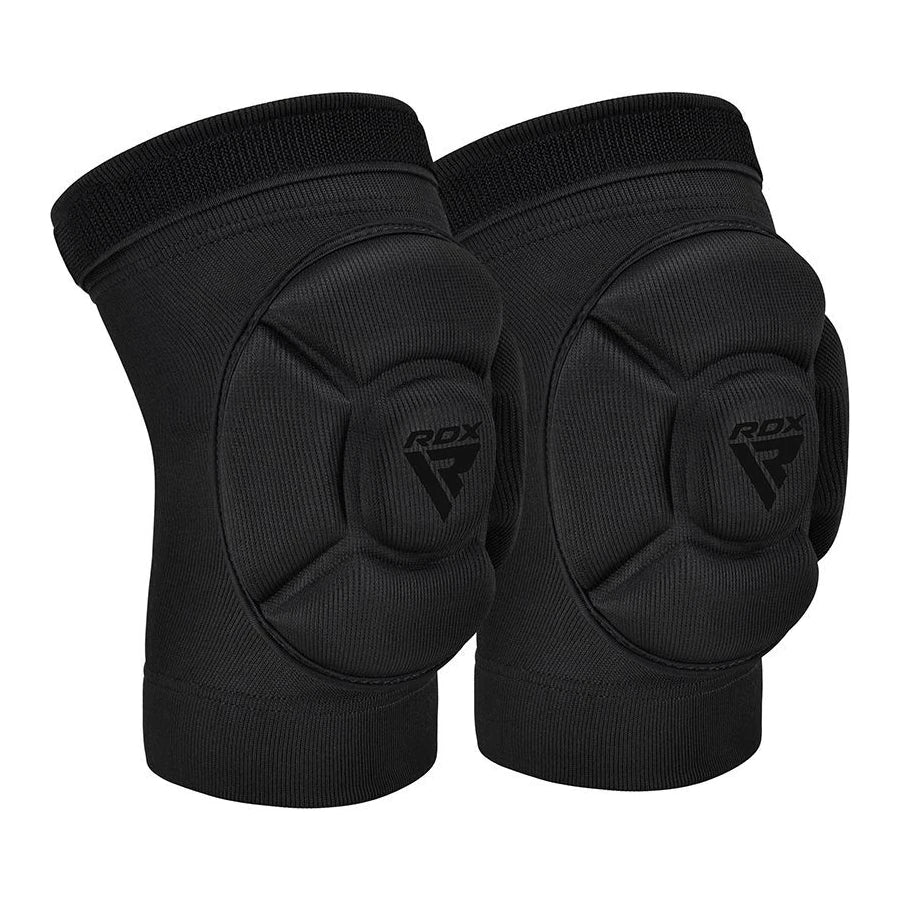 Pair of black knee pads with RDX logo on a white background