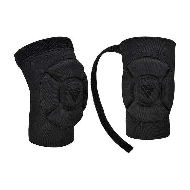 Pair of black knee pads with RDX logo on a white background