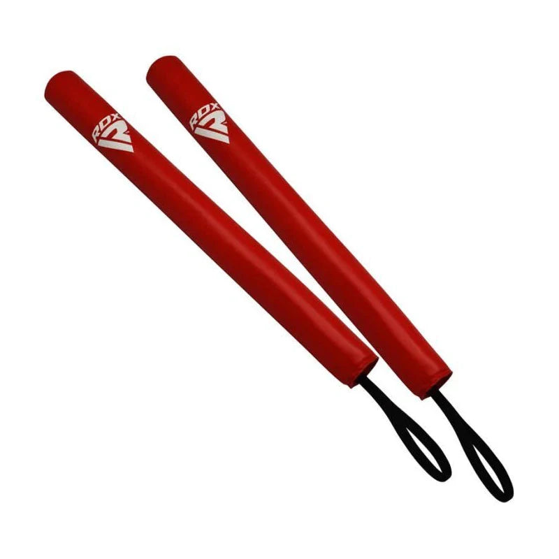 Two red foam boxing sticks with black ends on a white background