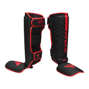 Black and red shin guards with 'RDX' branding on a white background