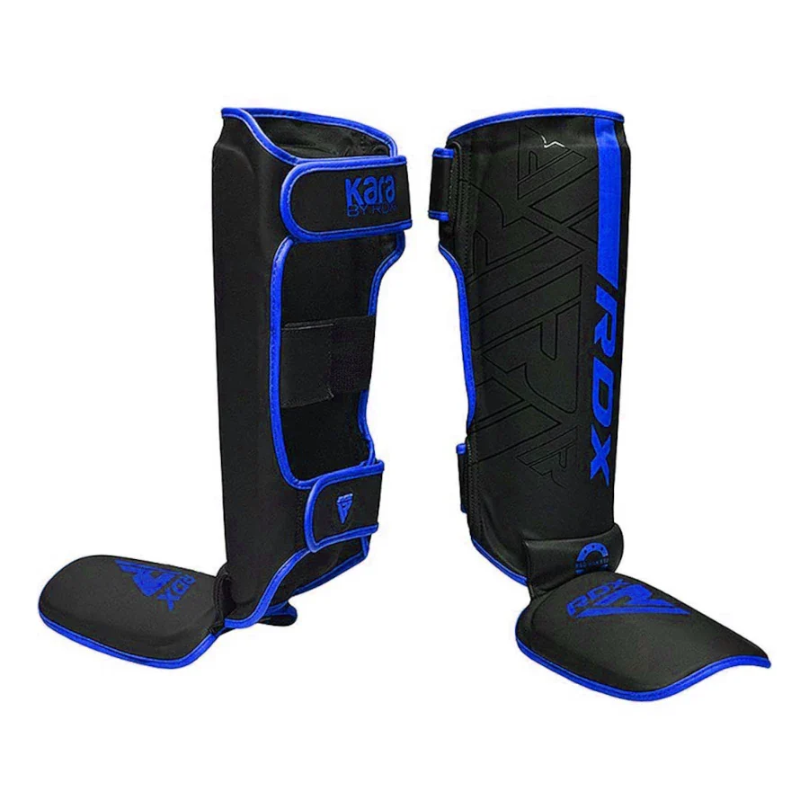 Black and blue shin guards with 'RDX' branding on a white background