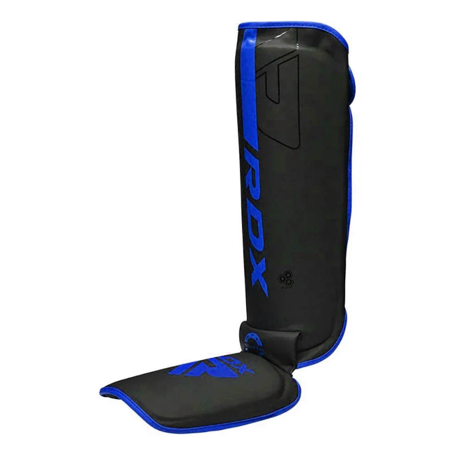 Black and blue RDX shin guard on a white background