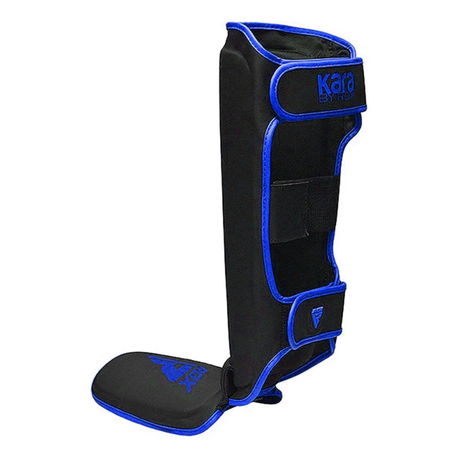 Black shin guard with blue accents on a white background
