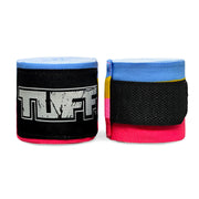 Pair of black and pink boxing hand wraps with blue accents on a white background