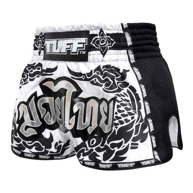 White boxing shorts with black and gray designs and 'TUFF' branding on a white background
