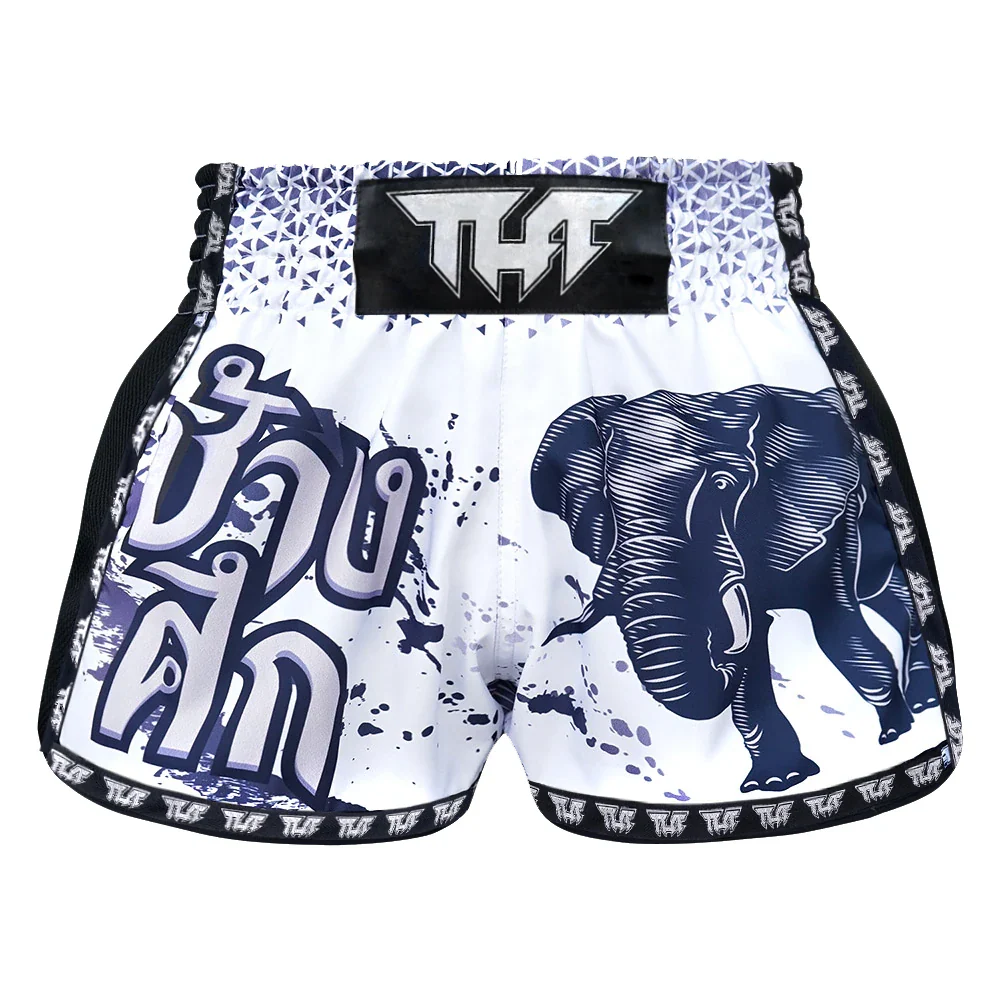 White Muay Thai shorts with elephant design and black text on a white background