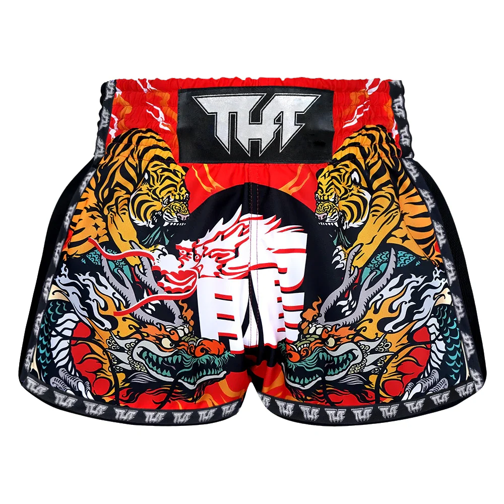 Colorful Muay Thai shorts with tiger and dragon design on a white background