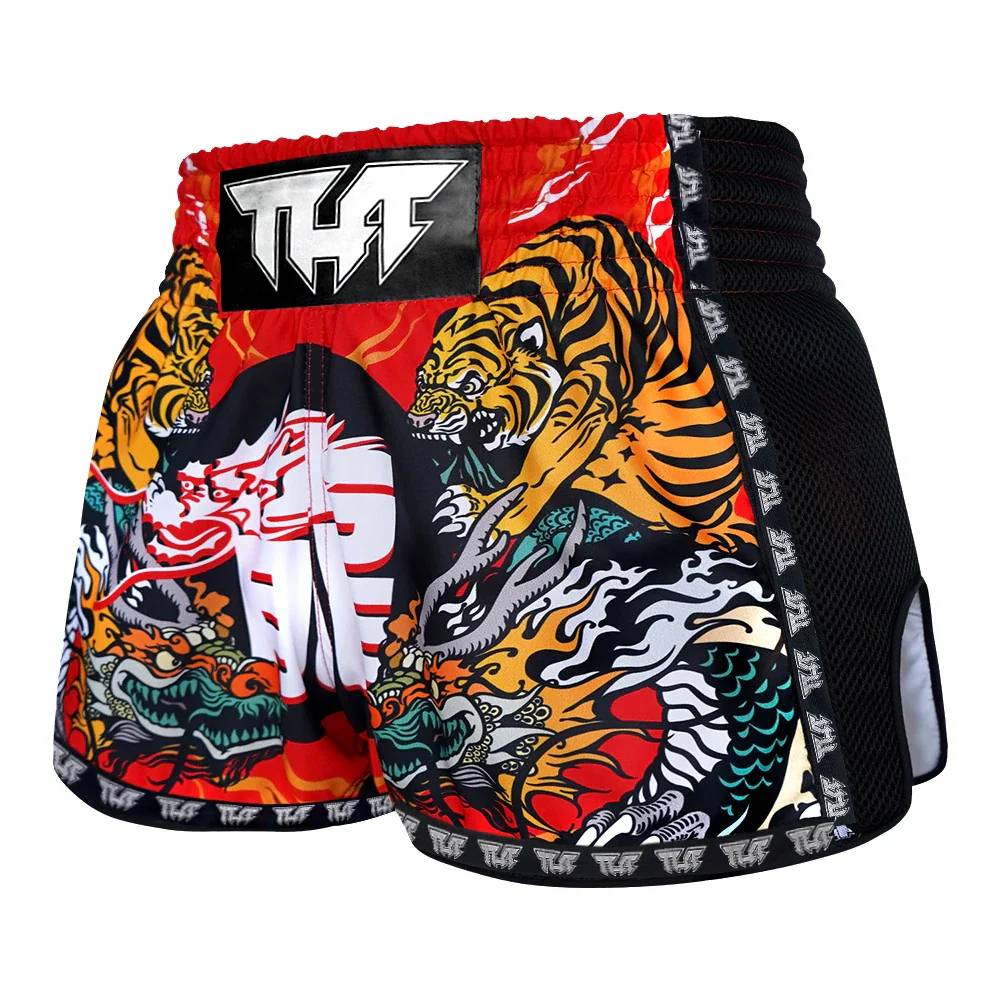 Colorful tiger-themed Muay Thai shorts with a brand logo on a white background