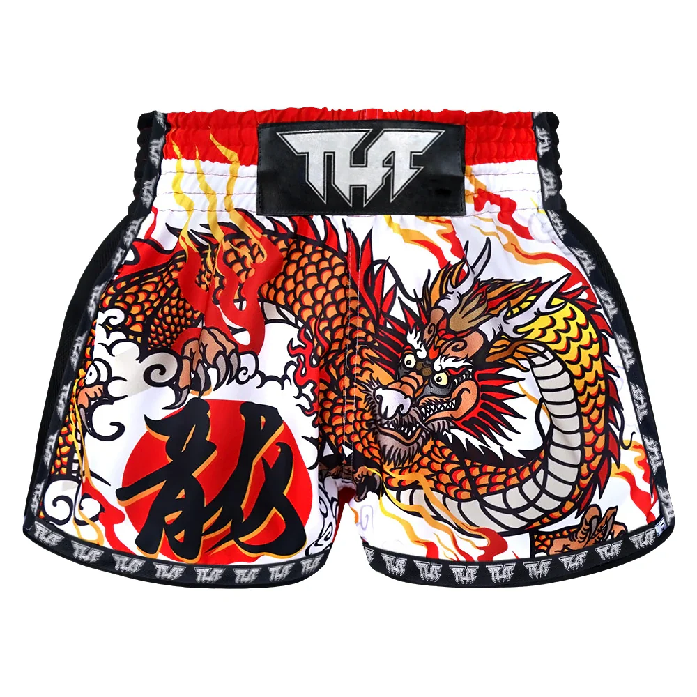 Colorful dragon design Muay Thai shorts with TUFF branding on a white background