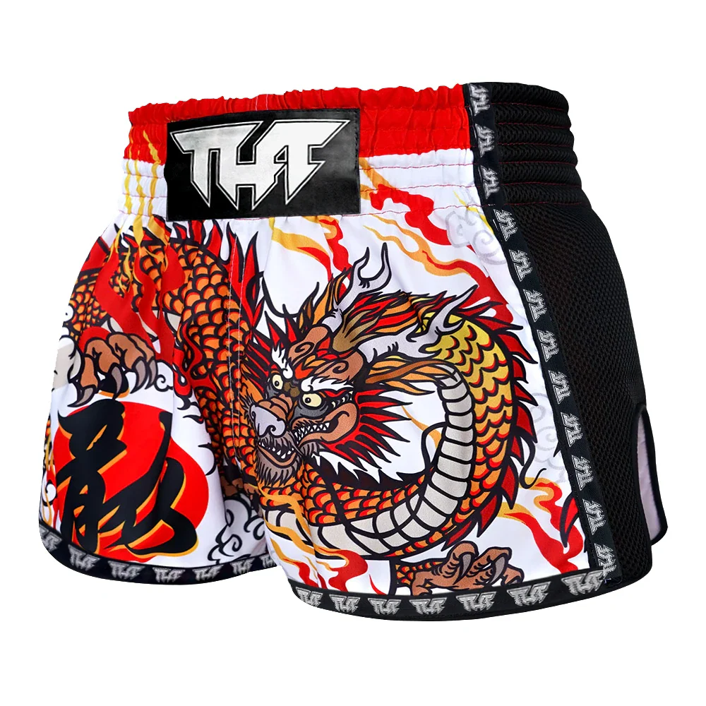 Colorful dragon design on a pair of Muay Thai shorts with a visible brand logo.