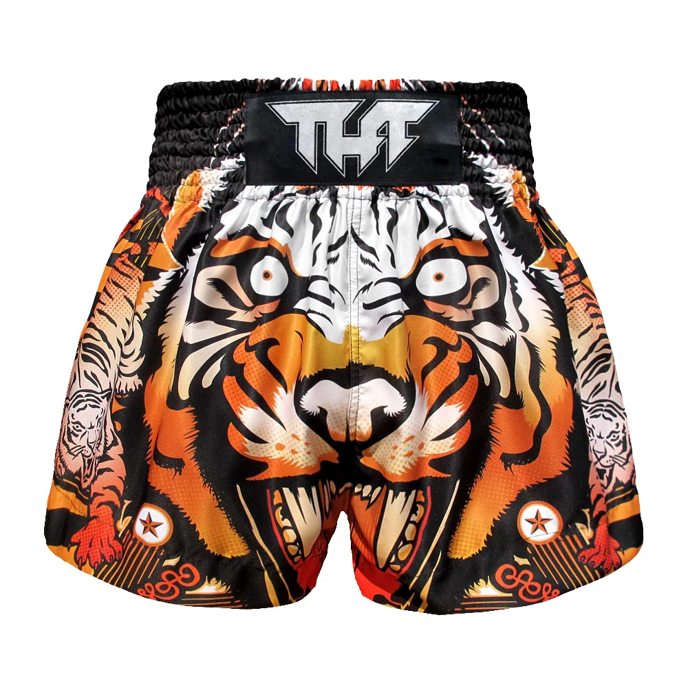 Tiger-themed Muay Thai shorts with a visible brand logo on a white background