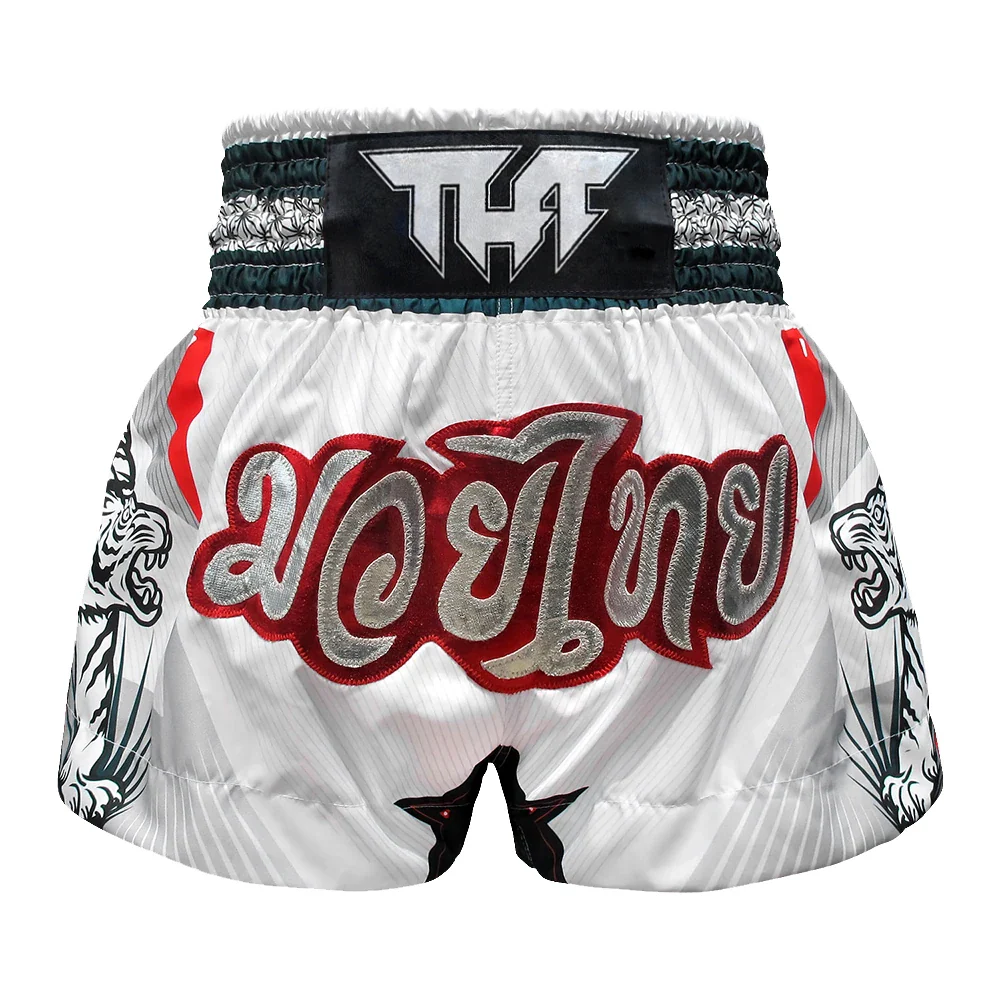 White Muay Thai shorts with red and black text on a white background