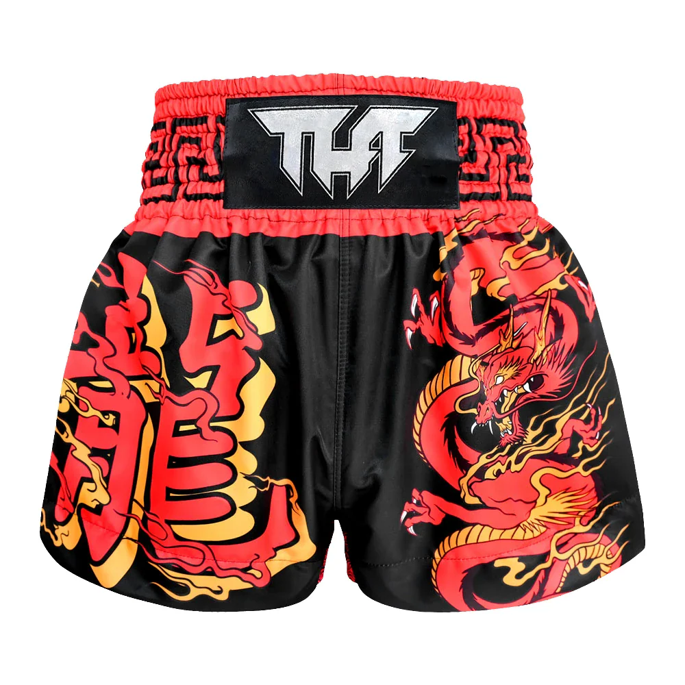 Black Muay Thai shorts with red and yellow dragon design on a white background