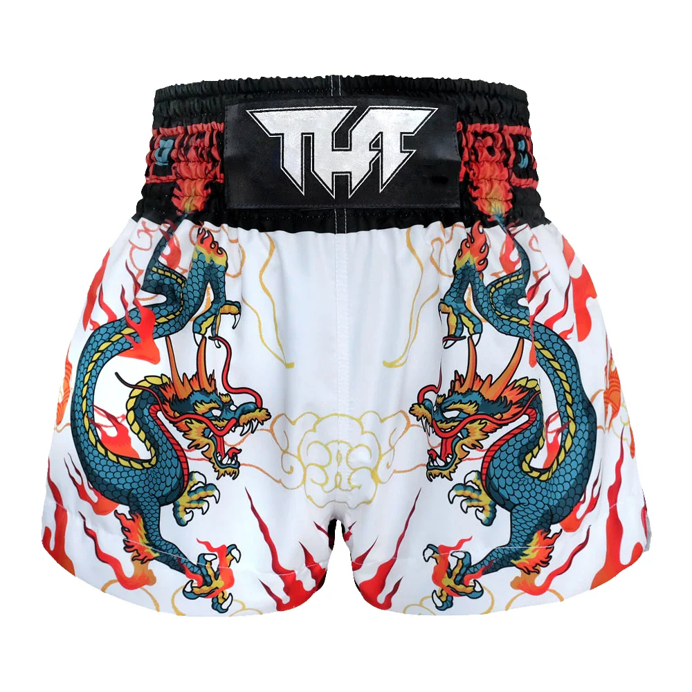 Muay Thai shorts with dragon design and THF branding on a white background