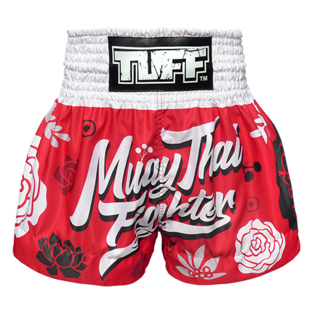 Red and white Muay Thai shorts with floral designs and 'TUFF' branding on a white background