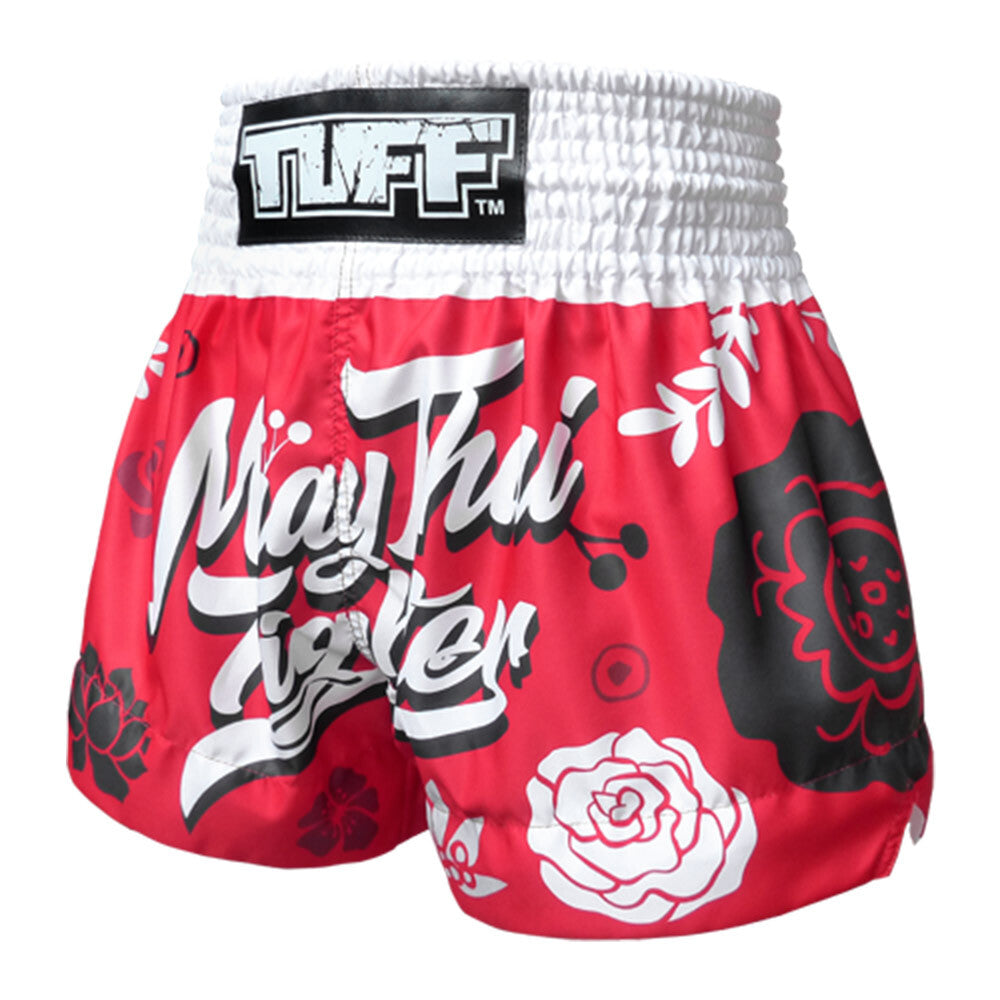 Red Muay Thai shorts with floral designs and 'TUFF' branding on a white background