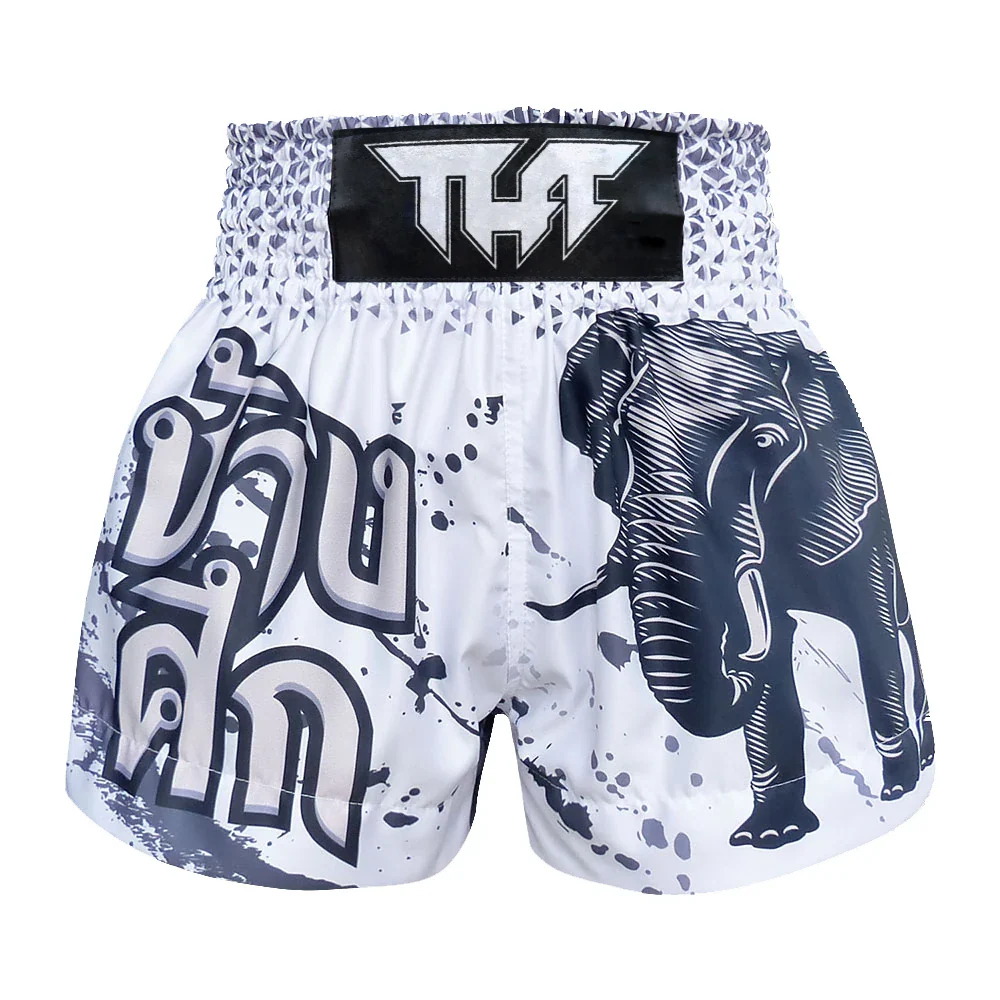White Muay Thai shorts with black elephant design and visible branding on a white background