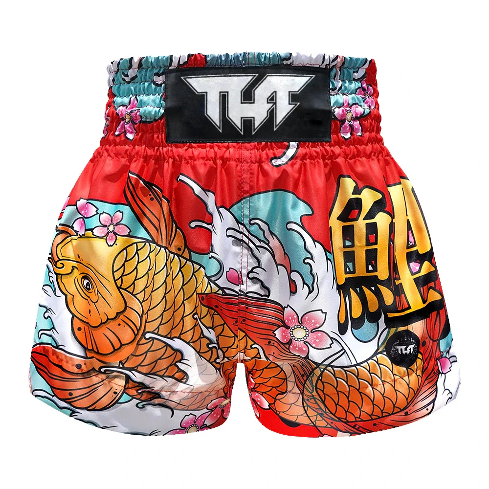 Colorful Muay Thai shorts with Koi fish design and THF branding on a white background