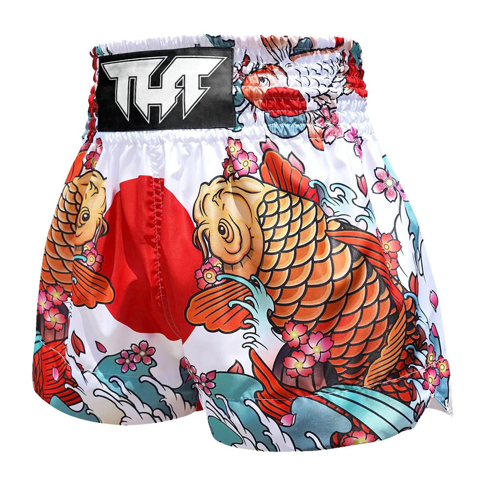 Colorful Muay Thai shorts with koi fish design and THF branding on a white background