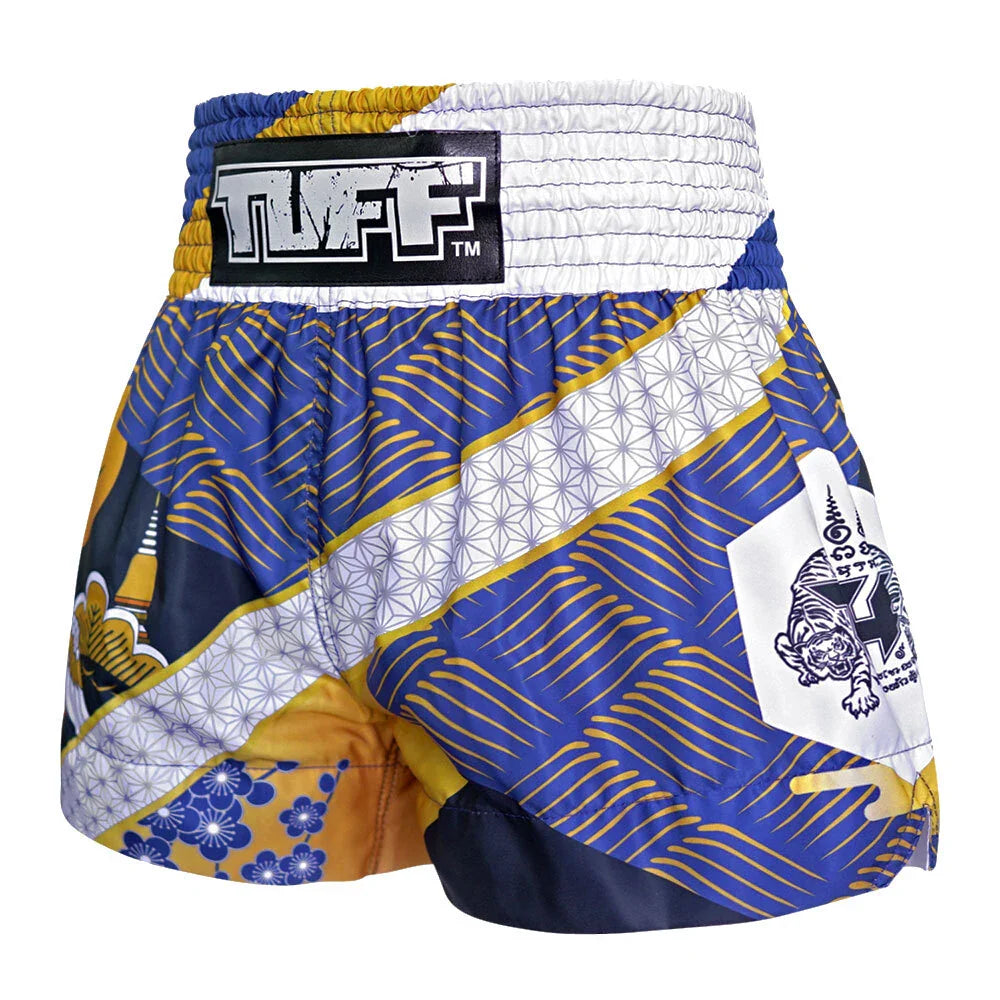 Colorful Muay Thai shorts with patterns and brand logo on a white background